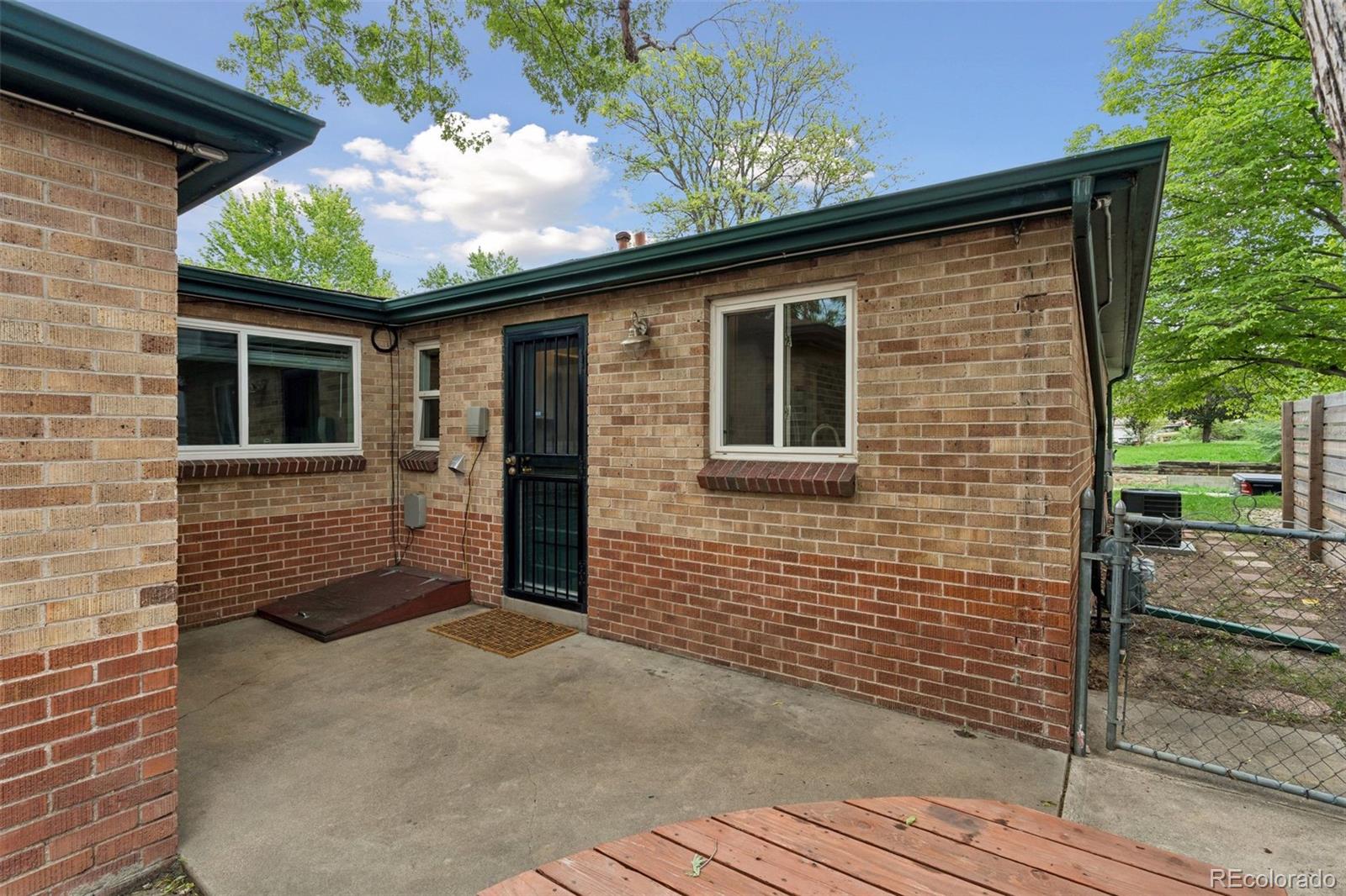 2255 Meade Street Denver, CO 80211 - Photo 21 of 30 a front view of a house with garden