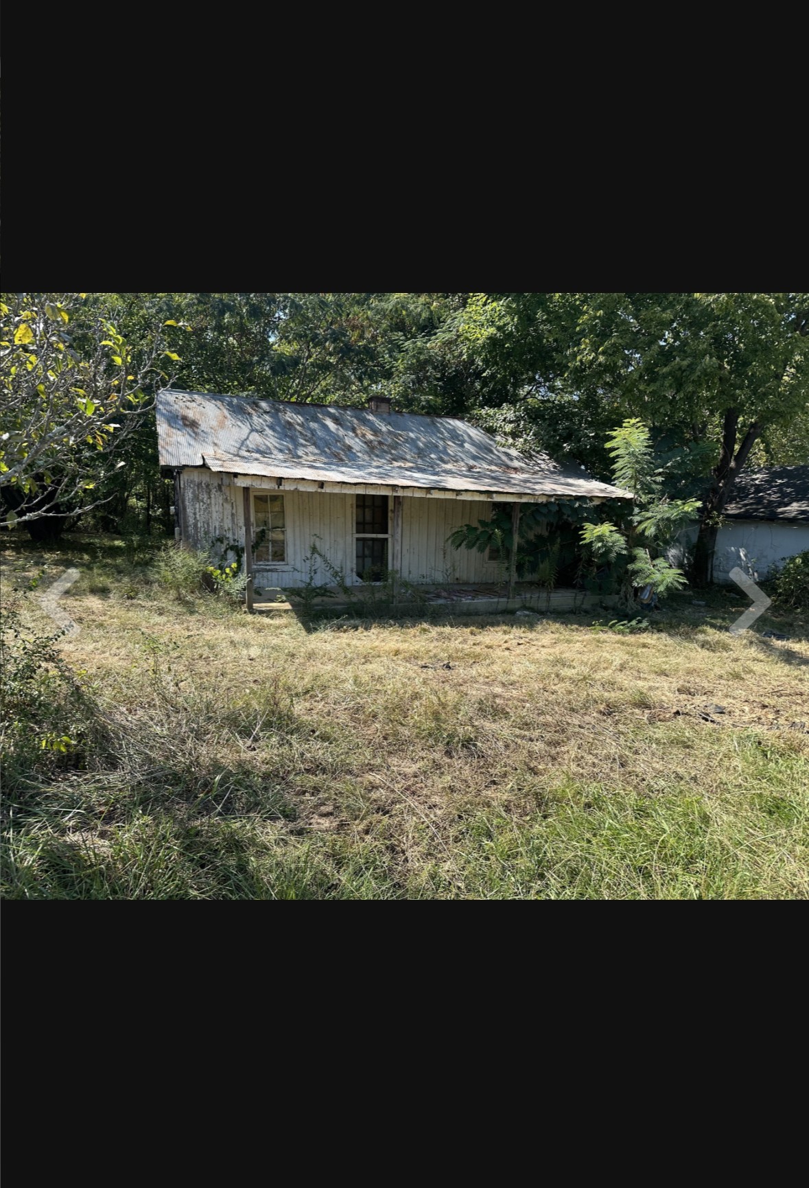 a view of a lake with a house in the background