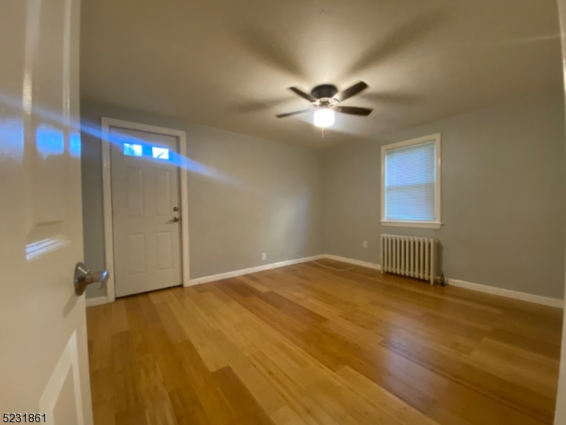 24 East 7th Street, Unit 2 Clifton, NJ 07011 - Photo 5 of 5 a view of an empty room