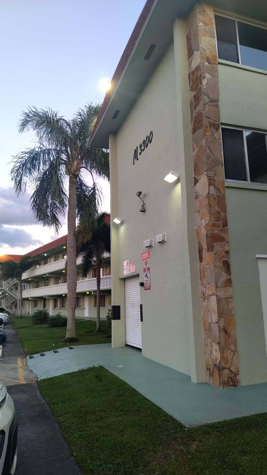 3300 Springdale Boulevard, Unit 208 Palm Springs, FL 33461 - Photo 1 of 21 a view of a house with a yard