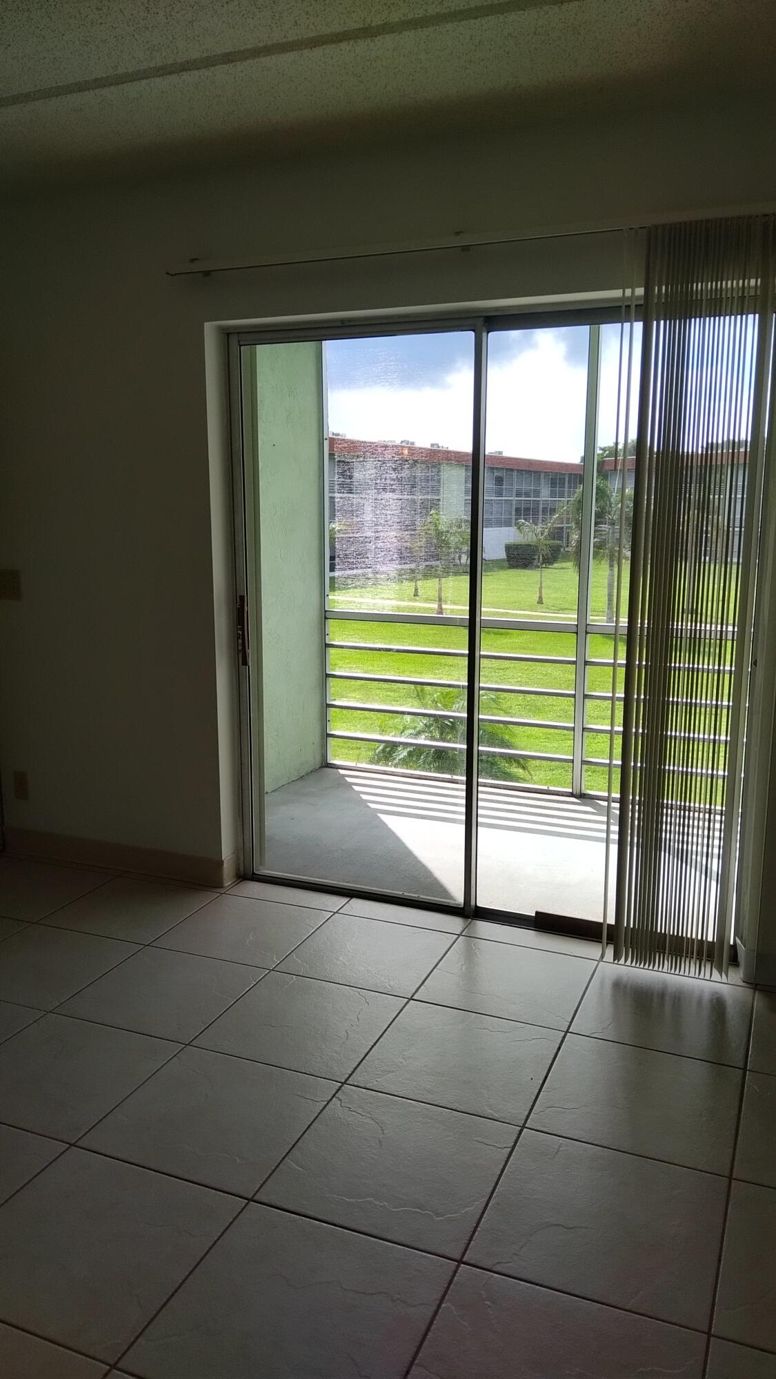 3300 Springdale Boulevard, Unit 208 Palm Springs, FL 33461 - Photo 14 of 21 a view of a room that has a window