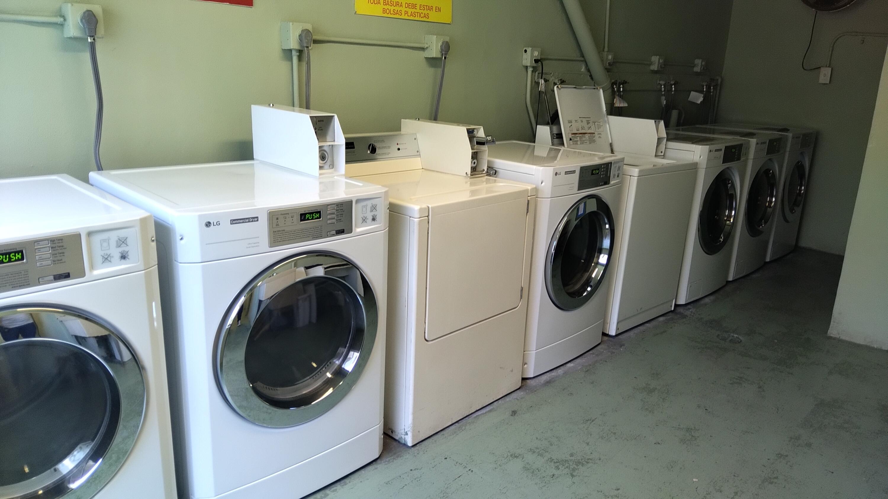 3300 Springdale Boulevard, Unit 208 Palm Springs, FL 33461 - Photo 6 of 21 a utility room with dryer and washer