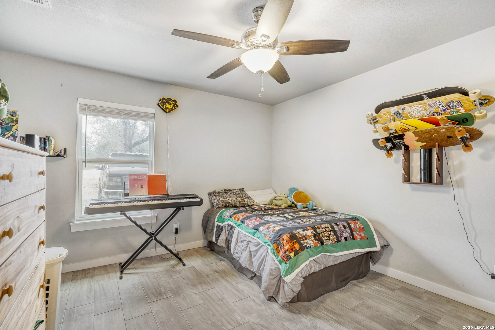 1209 Covered Wagon Spring Branch, TX 78070 - Photo 19 of 29 a bedroom with a bed and a chandelier