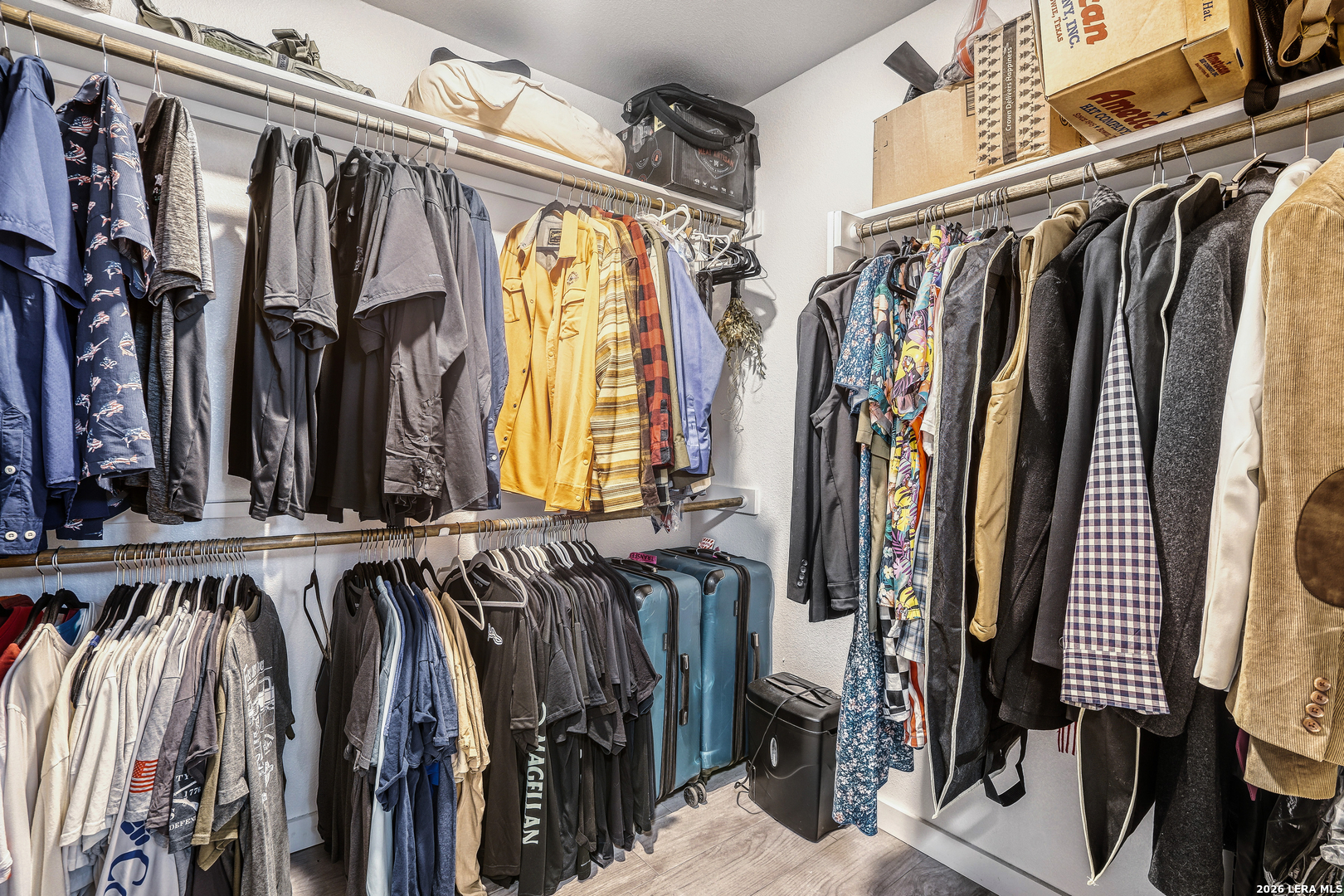 1209 Covered Wagon Spring Branch, TX 78070 - Photo 20 of 29 a view of walk in closet with clothes and shoes