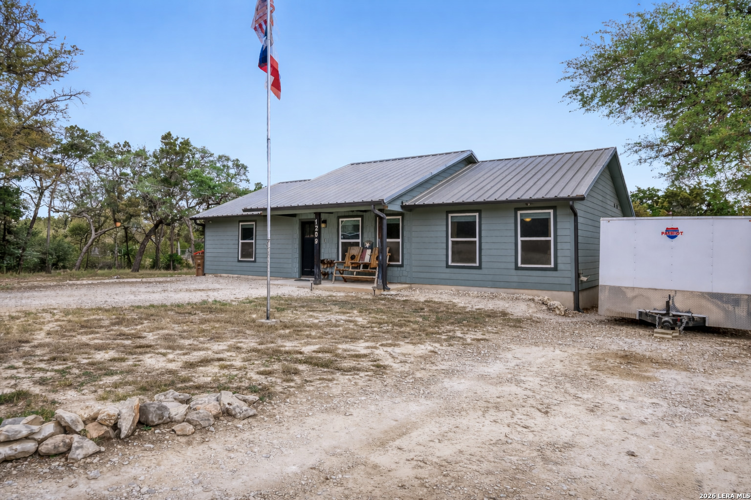 1209 Covered Wagon Spring Branch, TX 78070 - Photo 2 of 29 a backyard of a house