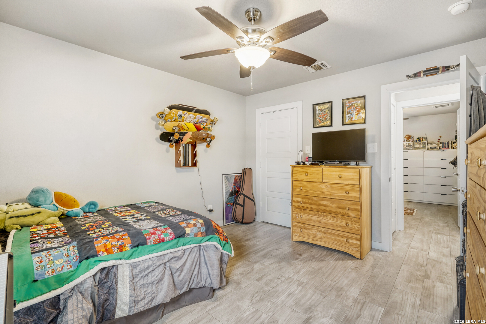 1209 Covered Wagon Spring Branch, TX 78070 - Photo 21 of 29 a bedroom with a bed and a chandelier