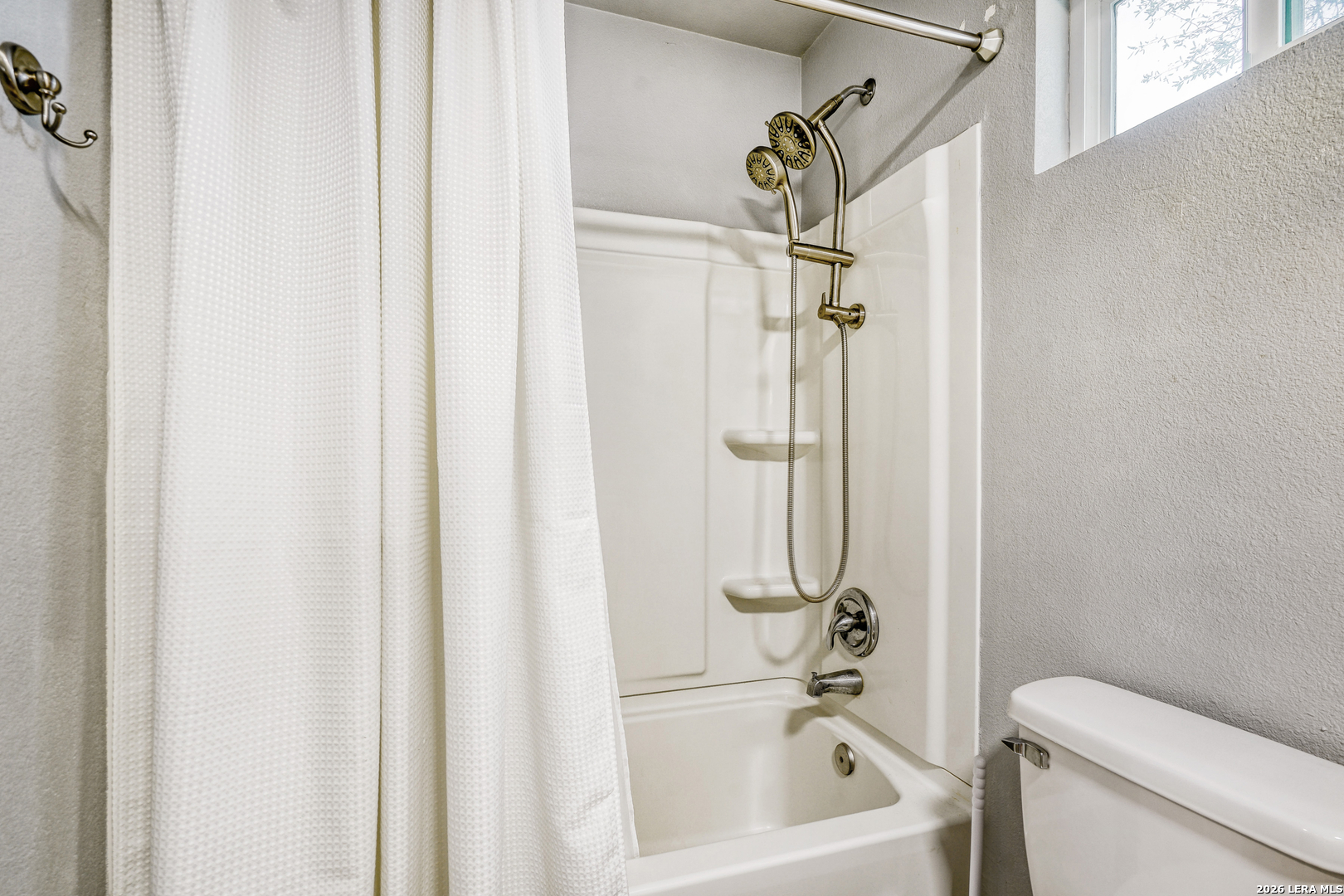 1209 Covered Wagon Spring Branch, TX 78070 - Photo 22 of 29 a bathroom with a shower a toilet and a tub
