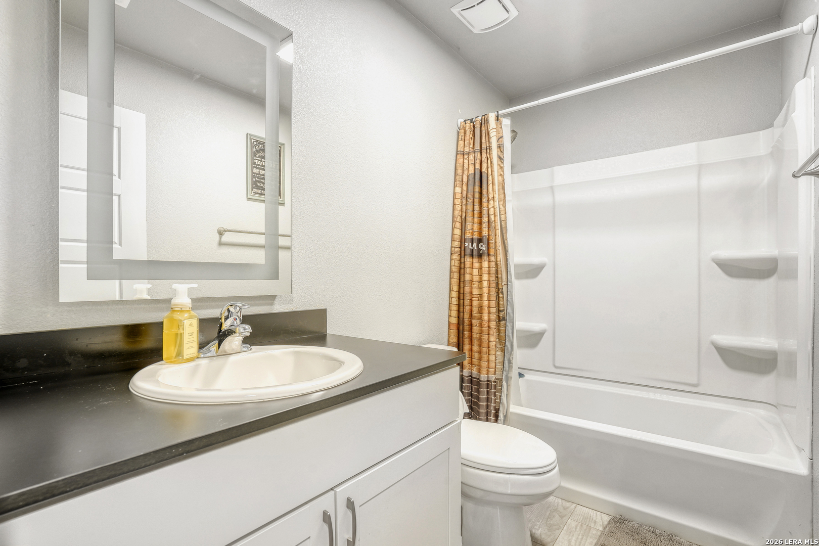 1209 Covered Wagon Spring Branch, TX 78070 - Photo 23 of 29 a bathroom with a sink a toilet and a mirror