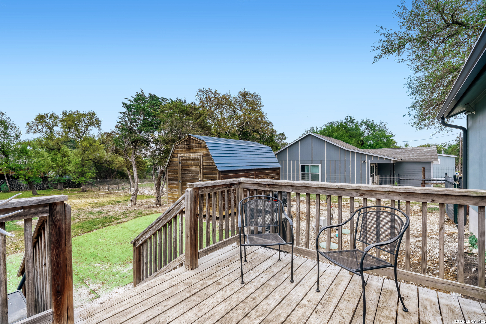 1209 Covered Wagon Spring Branch, TX 78070 - Photo 25 of 29 a view of a deck with two chair and a table