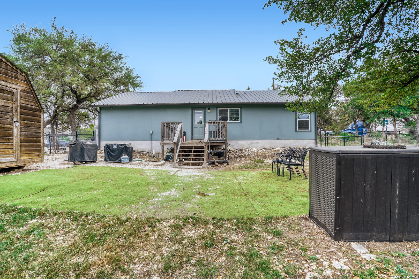 1209 Covered Wagon Spring Branch, TX 78070 - Photo 27 of 29 a backyard of a house with table and chairs