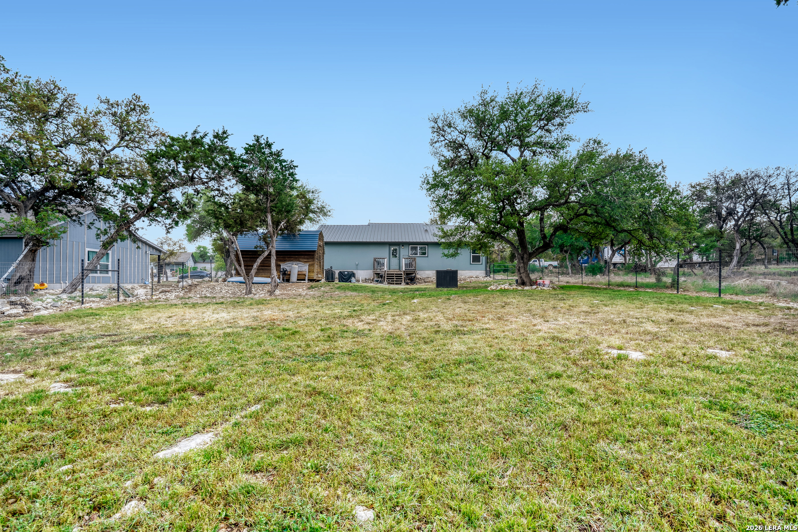 1209 Covered Wagon Spring Branch, TX 78070 - Photo 28 of 29 a front view of a house with a yard