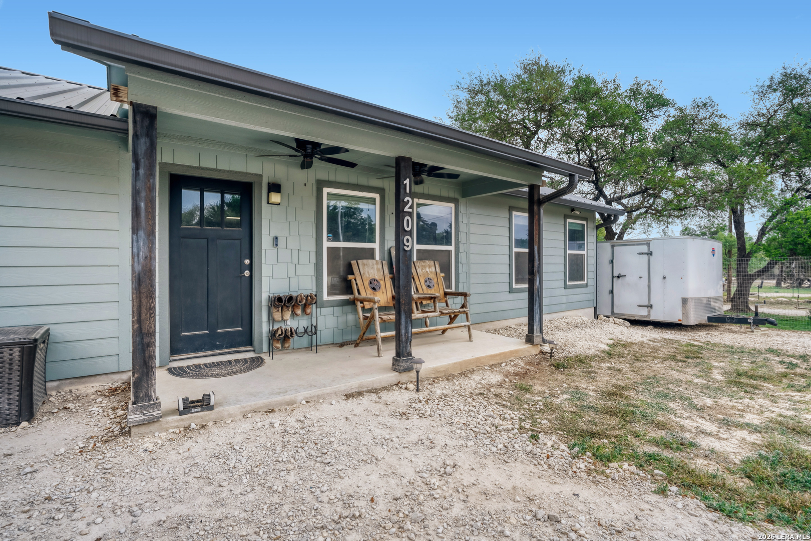 1209 Covered Wagon Spring Branch, TX 78070 - Photo 3 of 29 a view of a house with backyard and sitting area