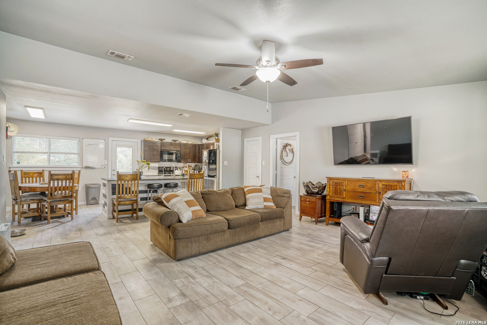 1209 Covered Wagon Spring Branch, TX 78070 - Photo 6 of 29 a living room with furniture and a flat screen tv