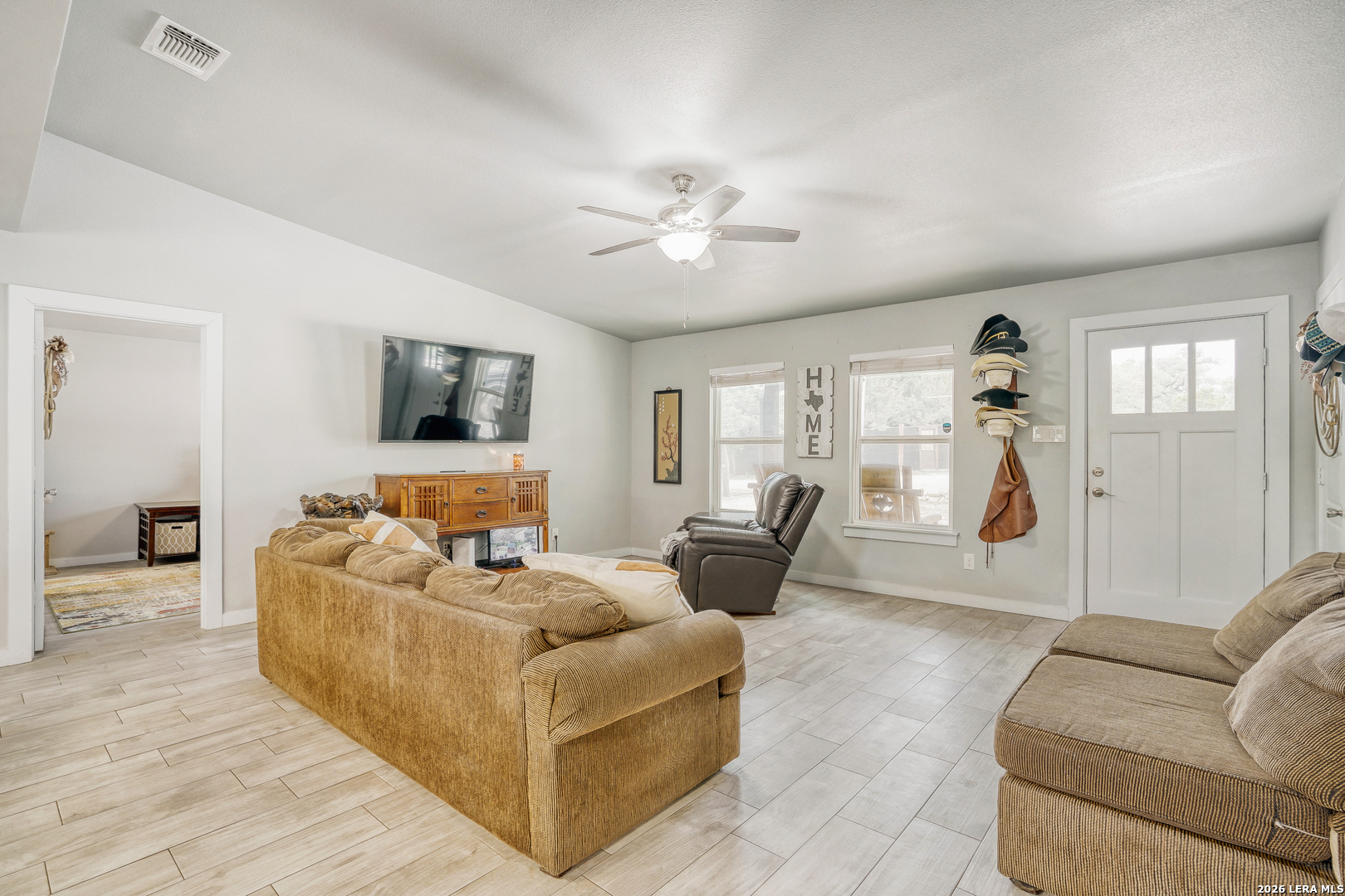 1209 Covered Wagon Spring Branch, TX 78070 - Photo 7 of 29 a living room with furniture and a flat screen tv