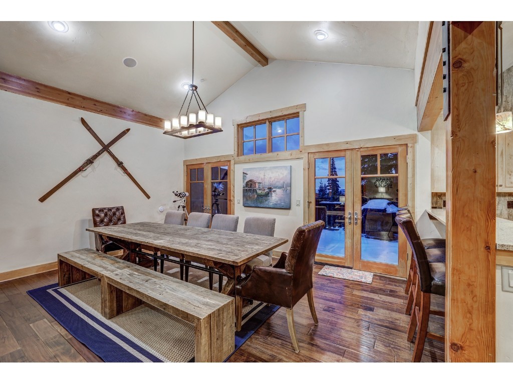 397 Whispering Pines Circle Blue River, CO 80424 - Photo 12 of 35 a view of a dining room with furniture and wooden floor