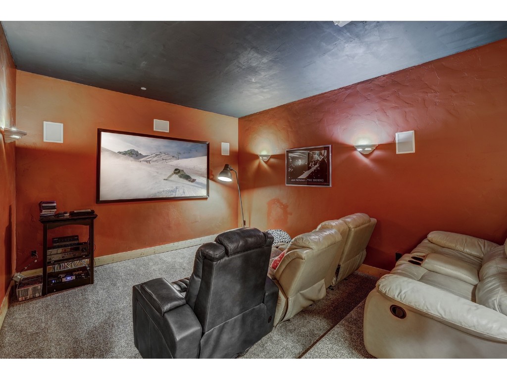 397 Whispering Pines Circle Blue River, CO 80424 - Photo 25 of 35 a living room with furniture and a flat screen tv