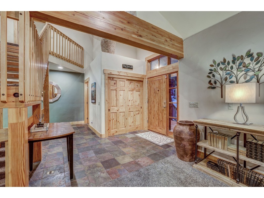 397 Whispering Pines Circle Blue River, CO 80424 - Photo 4 of 35 a view of a livingroom with furniture and a window