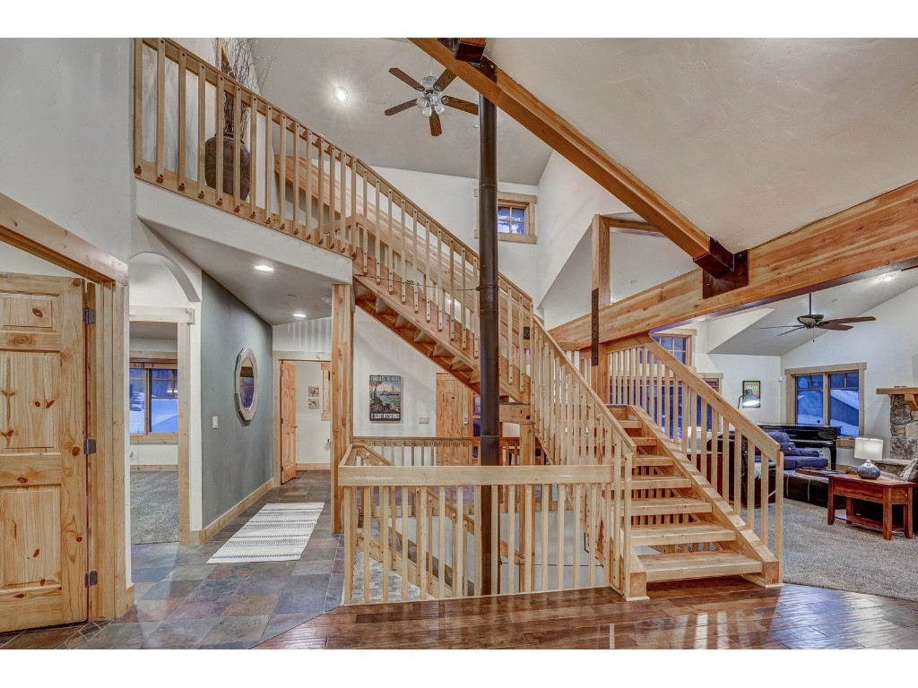 397 Whispering Pines Circle Blue River, CO 80424 - Photo 9 of 35 a view of staircase with lots of frames and frames on wall