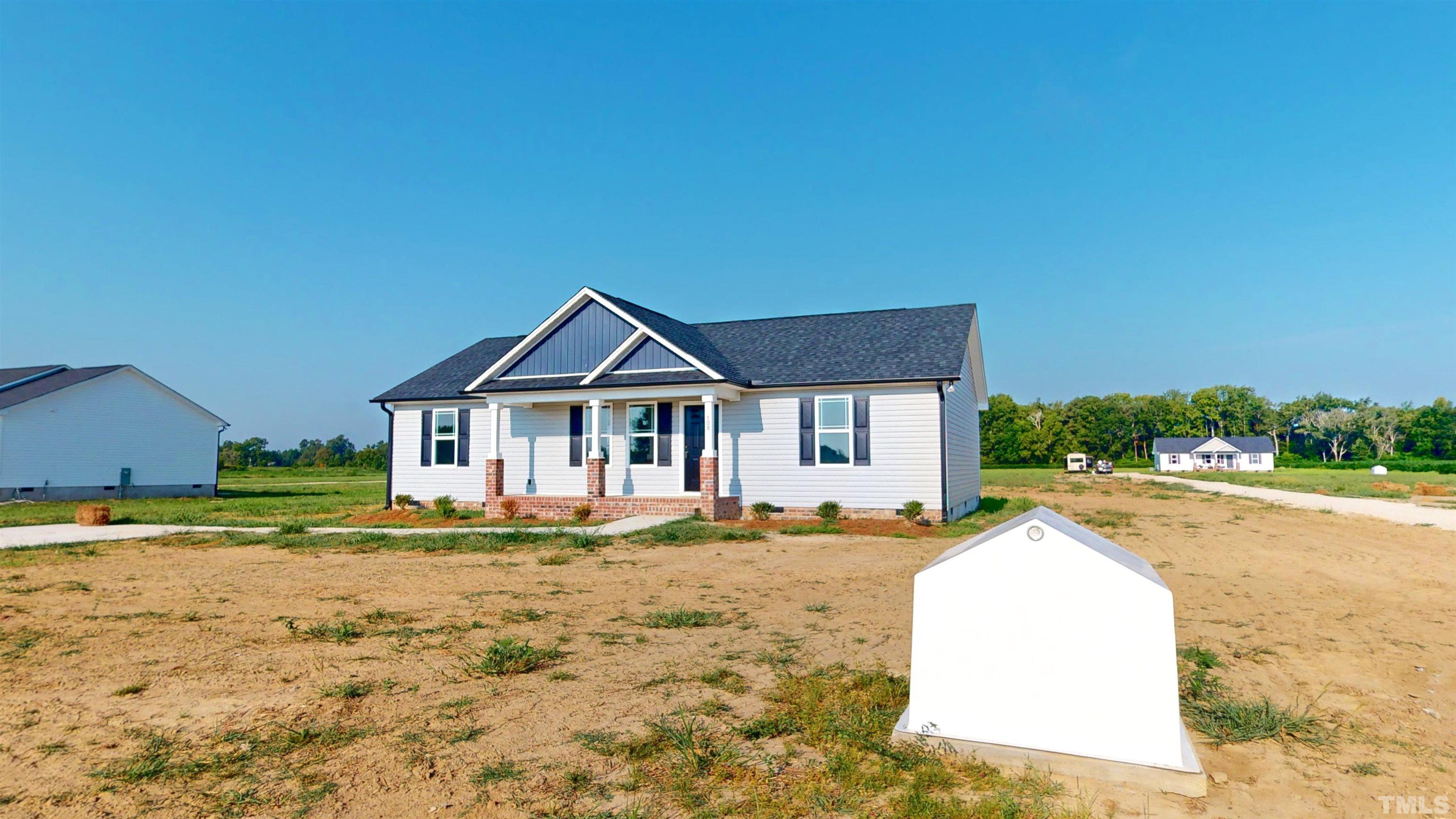 108 Mamie Road Benson, NC 27504 - Photo 2 of 31 a front view of a house with a yard