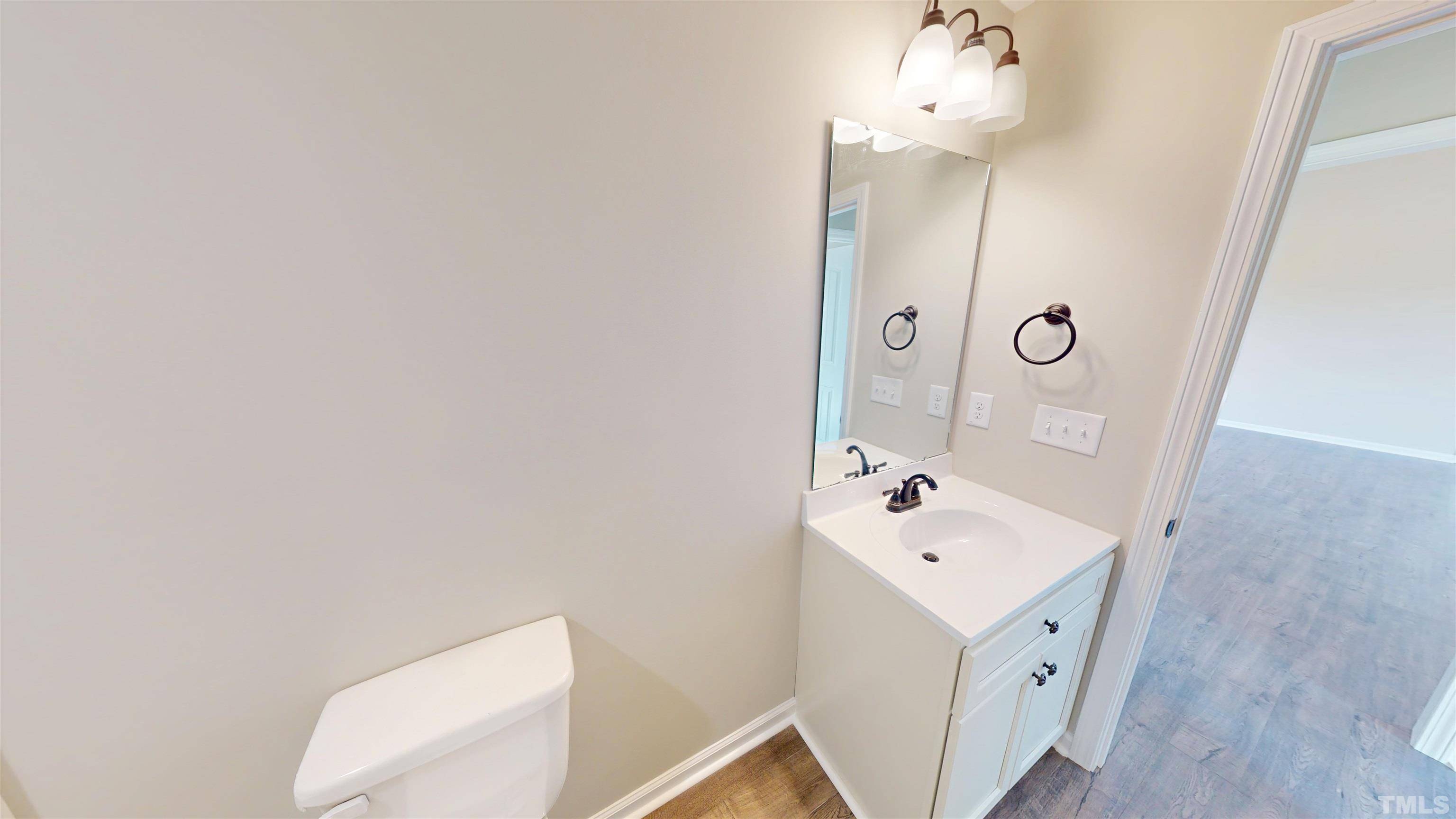 108 Mamie Road Benson, NC 27504 - Photo 21 of 31 a bathroom with a sink mirror and toilet