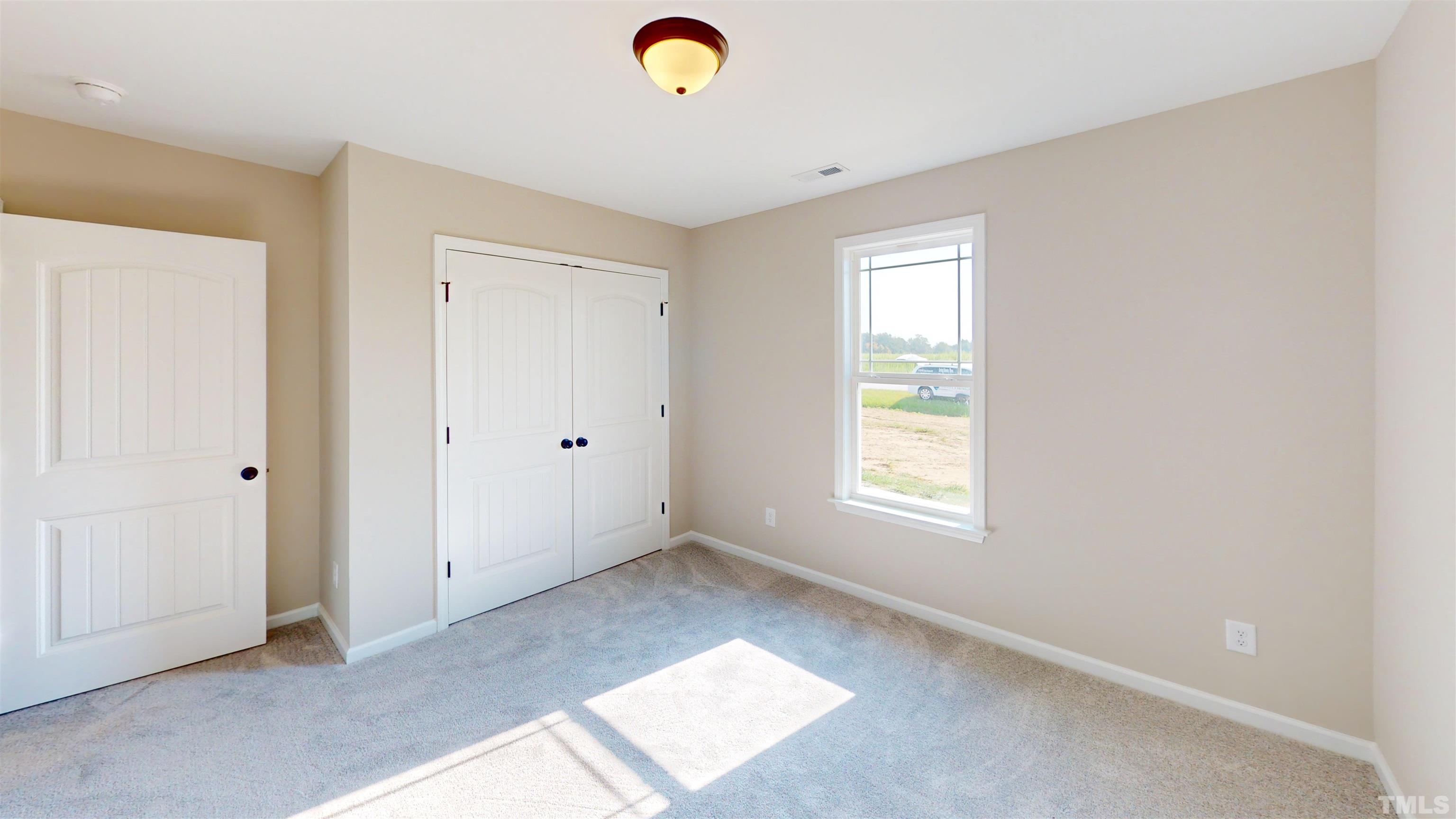 108 Mamie Road Benson, NC 27504 - Photo 22 of 31 a view of room with window