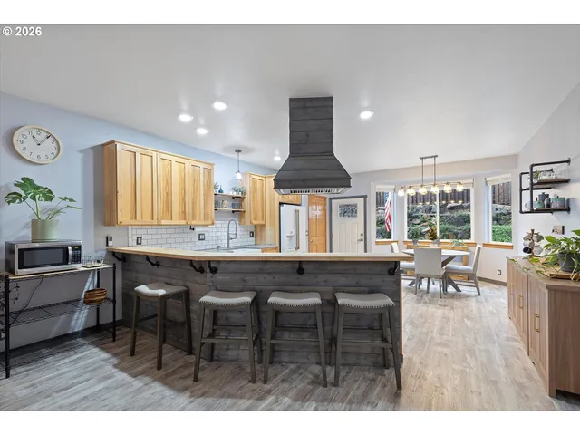 a kitchen with a table and chairs