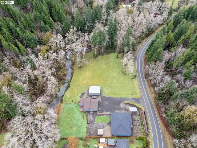 an aerial view of a house with outdoor space