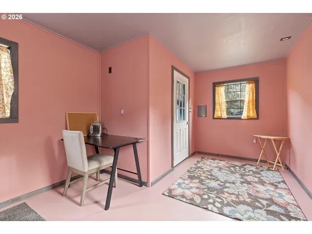 a workspace with furniture and window