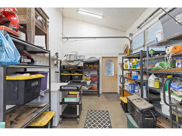 a view of a chairs and a table in the back of a building
