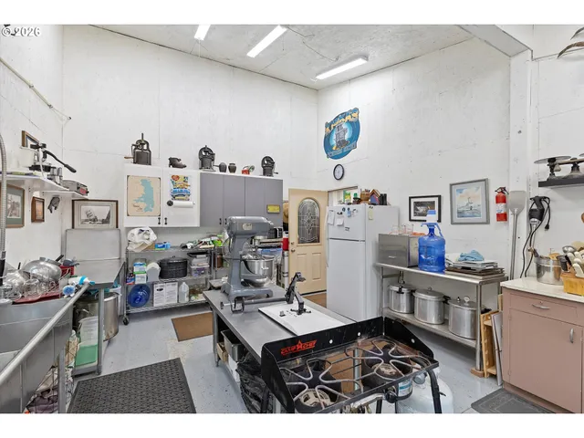a room with furniture a rug and a flat screen tv