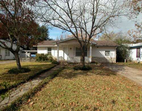 4408 Garnett Street Austin, TX 78745 - Photo 1 of 1 a front view of a house with a yard and garage