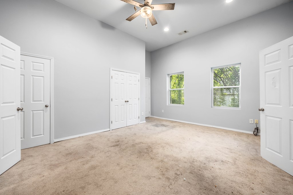 2113 Summerville Road Phenix City, AL 36867 - Photo 21 of 37 an empty room with windows and fan