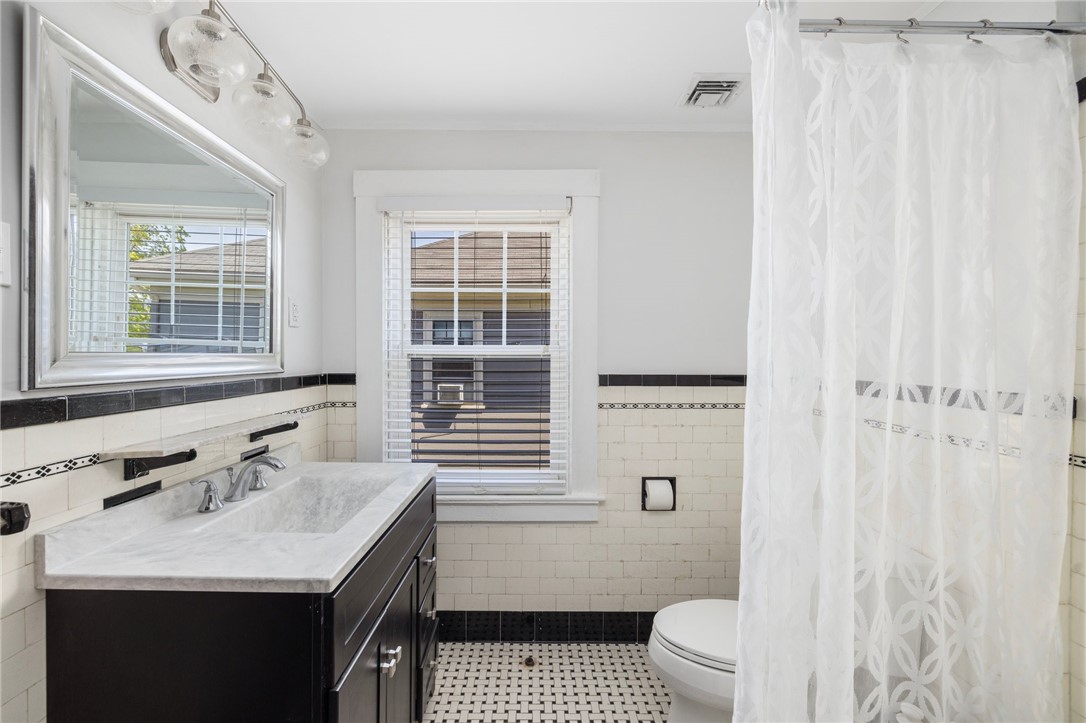 207 Rochambeau Avenue Providence, RI 02906 - Photo 28 of 39 renovated bathroom with original soaking tub..