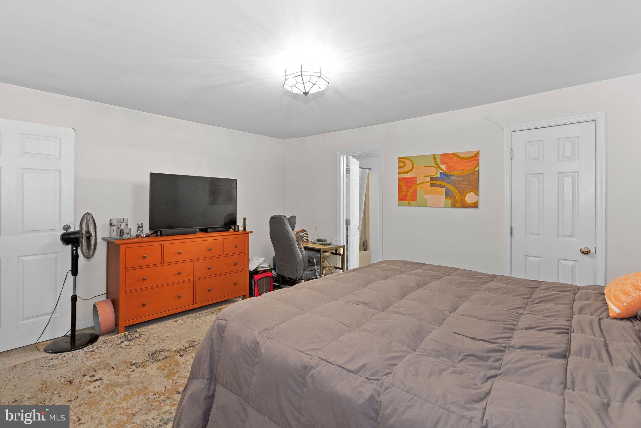 804 Telegraph Road Stafford, VA 22554 - Photo 24 of 39 a bedroom with a bed and a flat screen tv