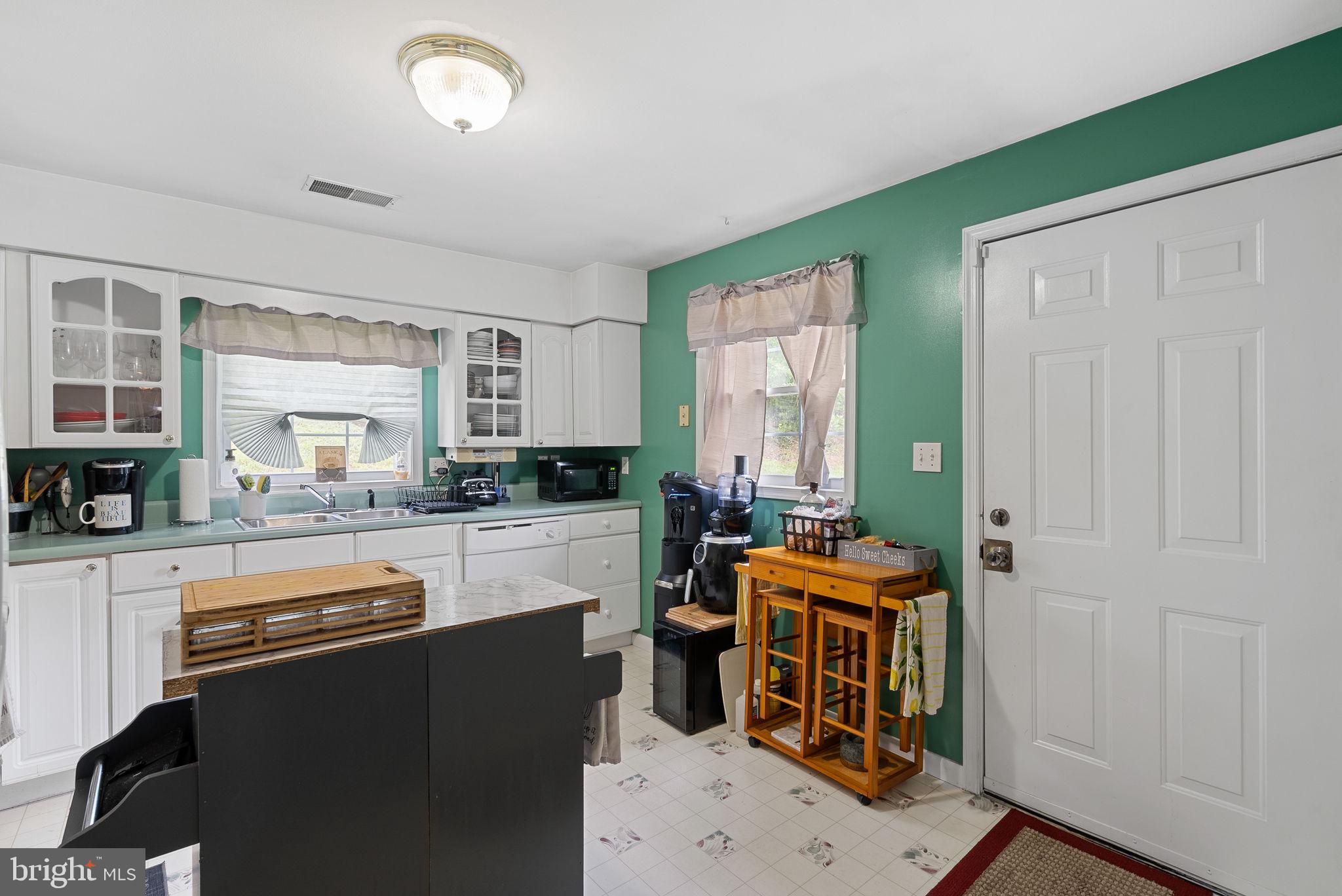 804 Telegraph Road Stafford, VA 22554 - Photo 30 of 39 a kitchen with stainless steel appliances granite countertop a stove a sink and a refrigerator