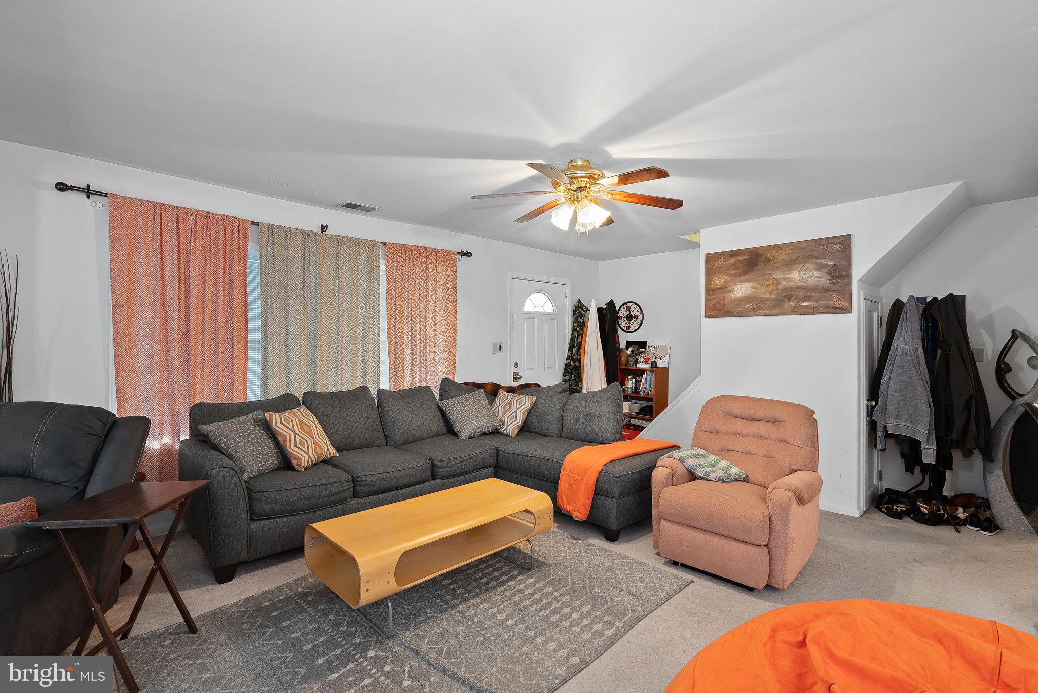 804 Telegraph Road Stafford, VA 22554 - Photo 33 of 39 a living room with furniture a flat screen tv and a window