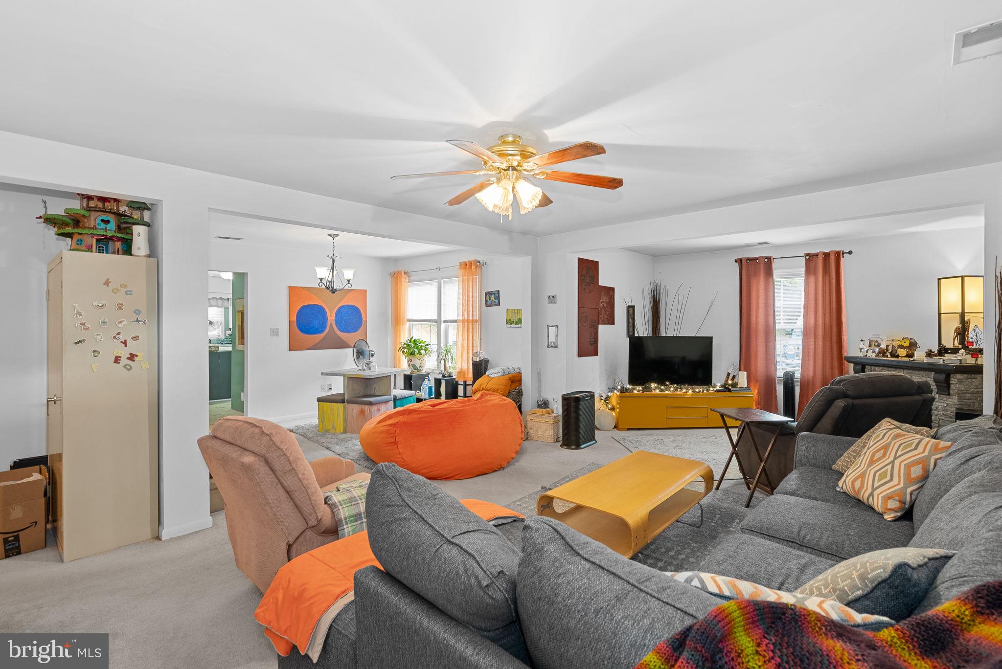 804 Telegraph Road Stafford, VA 22554 - Photo 37 of 39 a living room with furniture a couch and a chandelier