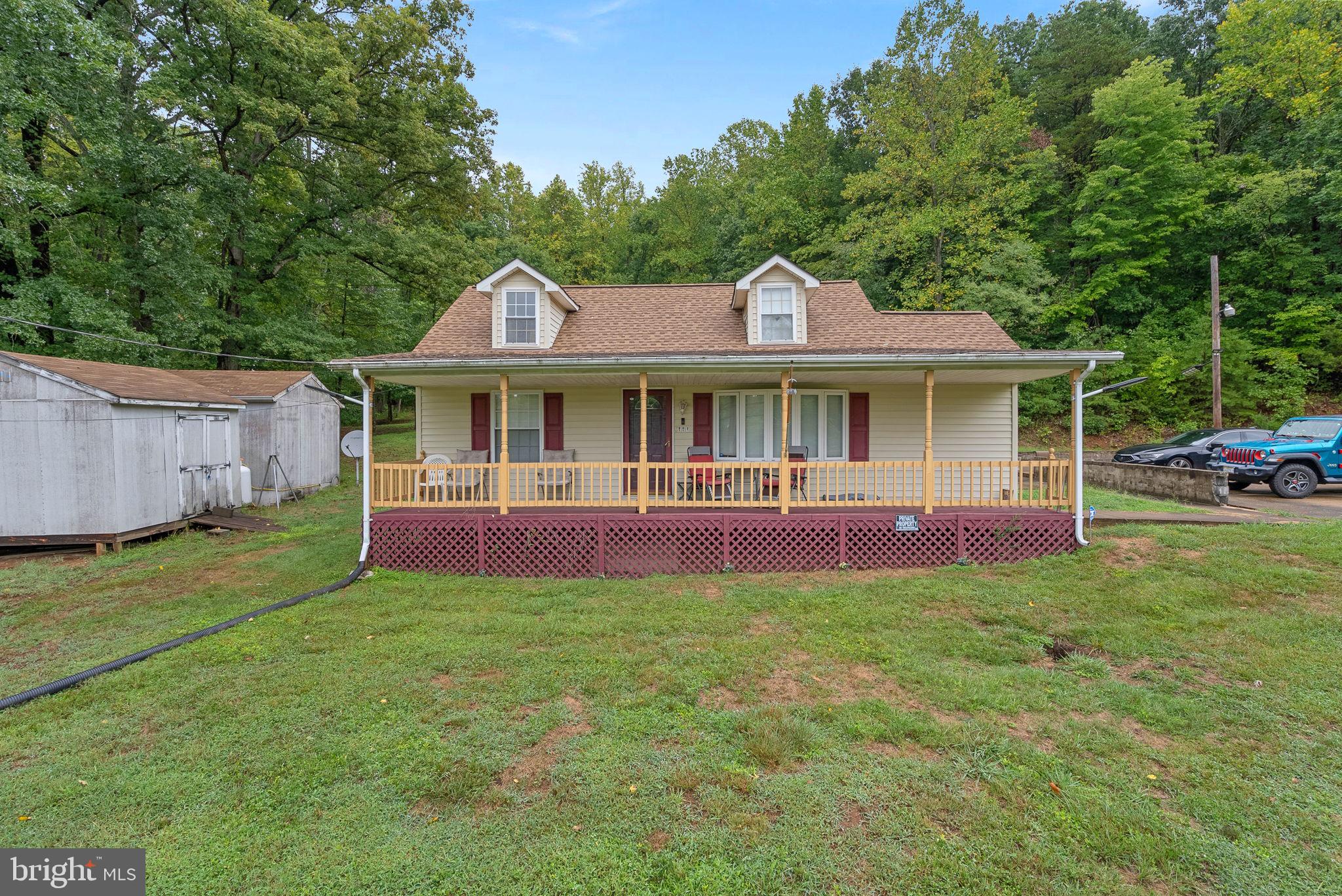 804 Telegraph Road Stafford, VA 22554 - Photo 38 of 39 a front view of a house with a garden and trees