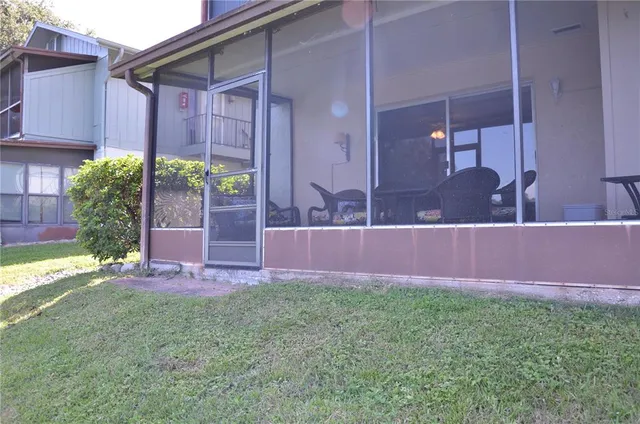 a view of front door and yard