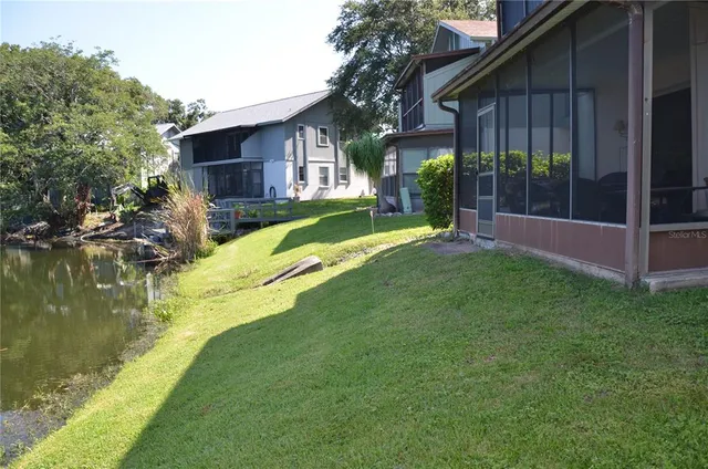 a view of a house with a yard porch and sitting area