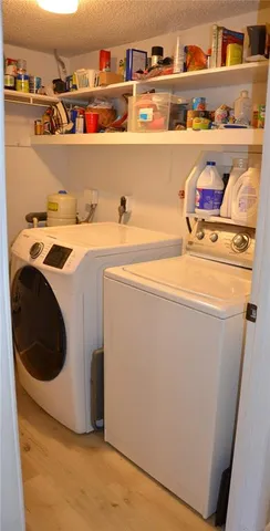 a view of a bathroom with a sink and a mirror