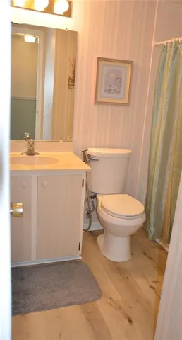 a bedroom with bed and a window