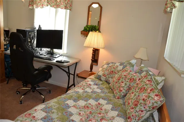 a bedroom with a bed and a cabinets