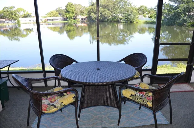 a backyard of a house with outdoor seating