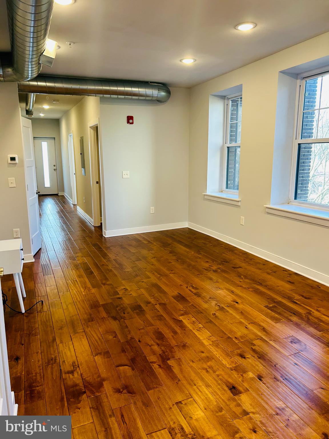 6090 Drexel Road, Unit 3 Philadelphia, PA 19131 - Photo 6 of 10 a view of livingroom with hardwood floor and window