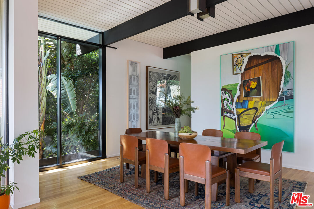 4520 Dundee Drive Los Angeles, CA 90027 - Photo 14 of 63 a dining room with furniture and wooden floor