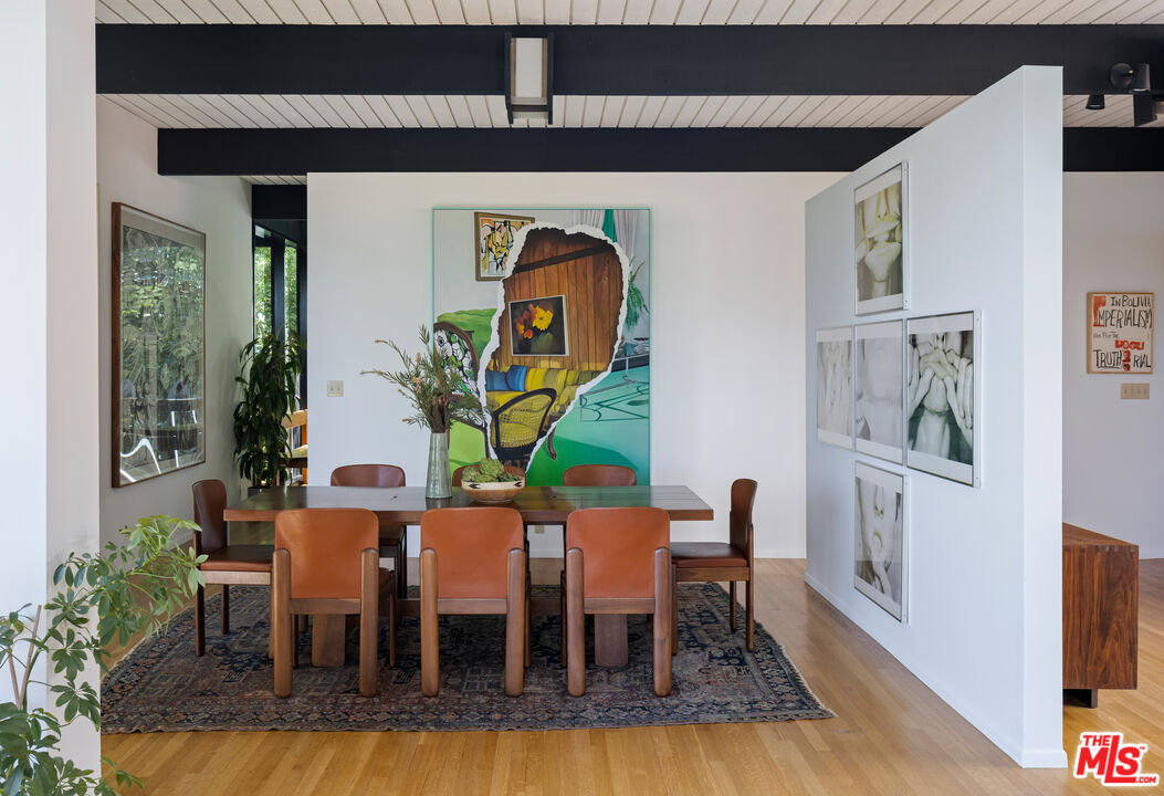 4520 Dundee Drive Los Angeles, CA 90027 - Photo 15 of 63 a dining room with furniture and wooden floor