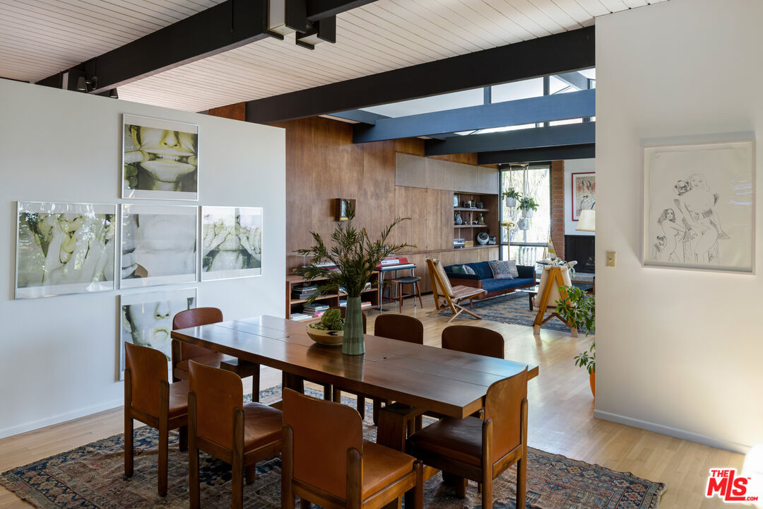 4520 Dundee Drive Los Angeles, CA 90027 - Photo 16 of 63 a view of a dining room with furniture and wooden floor
