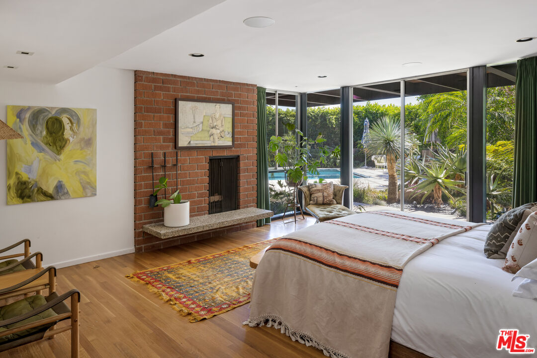 4520 Dundee Drive Los Angeles, CA 90027 - Photo 29 of 63 a bedroom with a bed and glass window