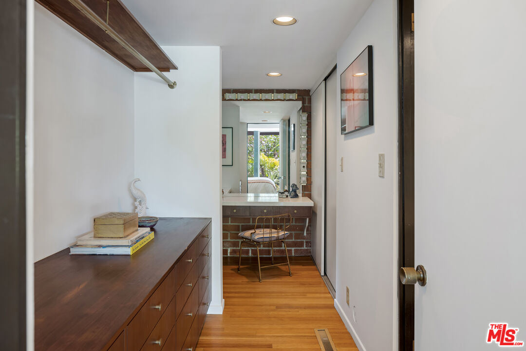 4520 Dundee Drive Los Angeles, CA 90027 - Photo 33 of 63 a view of a hallway with workspace and a window